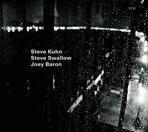 "Album cover with black and white rainy scene and artist names in white text."