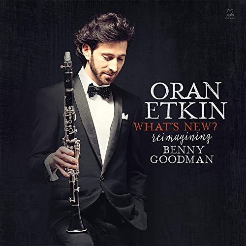 Oran Etkin holds a clarinet, album cover for “What’s New”.