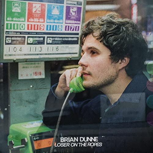 Album cover for Brian Dunne’s “Loser On The Ropes” featuring a man with a phone.