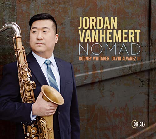 Saxophonist Jordan Vanhemert in a suit, album cover for "Nomad.