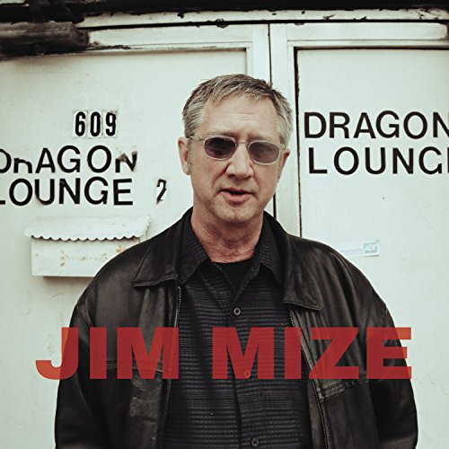 Man wearing sunglasses and leather jacket stands before a white door with "DRAGON LOUNGE" text.