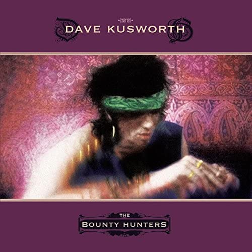 Album cover featuring Dave Kusworth wearing a green headband against a purple paisley background.
