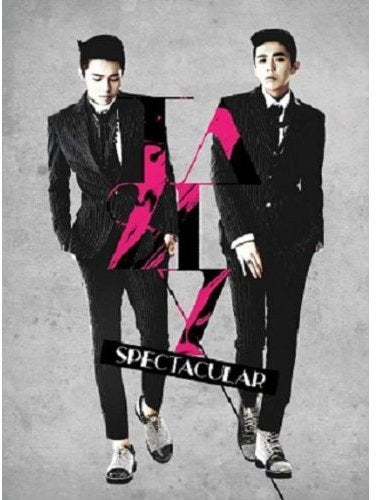 CD cover featuring two men in suits with a large pink "V".