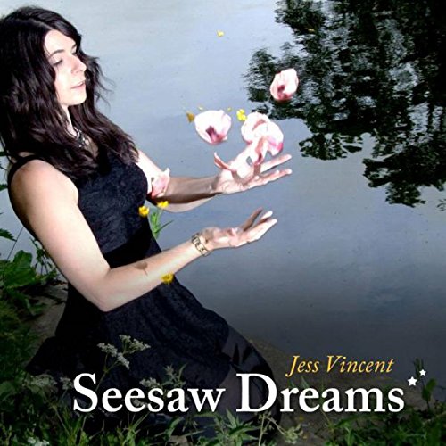"Album cover: woman in black dress releasing flowers by a body of water."