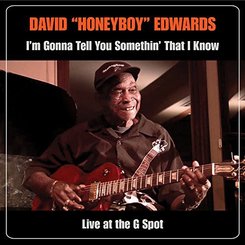 "Album cover featuring David 'Honeyboy' Edwards holding a guitar, smiling, on a black background."