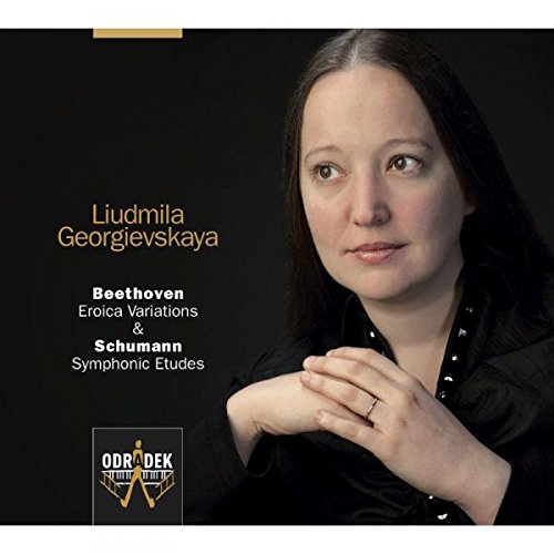 CD cover featuring a woman with dark hair against a black background.