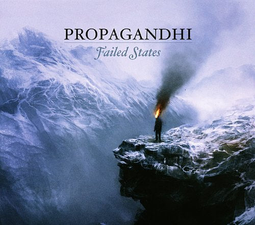 Album cover: person with flaming head on a snowy cliff.