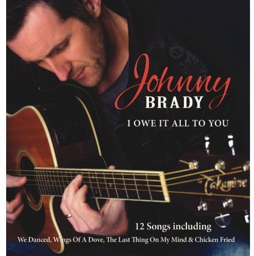 Johnny Brady album cover featuring a man with an acoustic guitar.