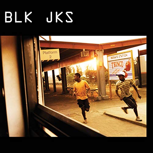 BLK JKS album cover: two young men running alongside a train platform.
