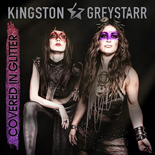 CD cover featuring two women with dramatic makeup and ornate accessories.