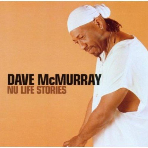 Album cover with man in white clothing and head wrap against orange background.