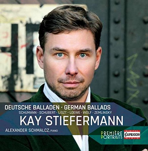 Man in dark jacket and white shirt on a music CD cover.