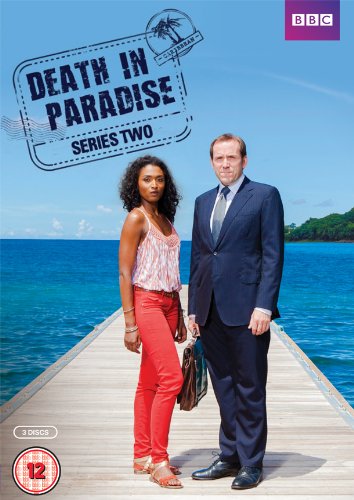 "DVD cover featuring a man and woman standing on a dock by the ocean."