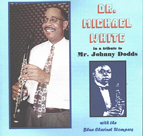 Album cover featuring a man holding a clarinet, with a portrait below the title.