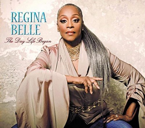 "Regina Belle album cover featuring a woman with long hair sitting against a beige background."