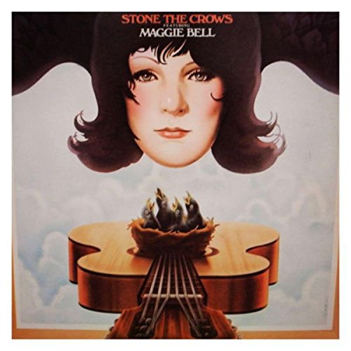 "Album cover with a woman's face and a burning guitar against a cloudy background."