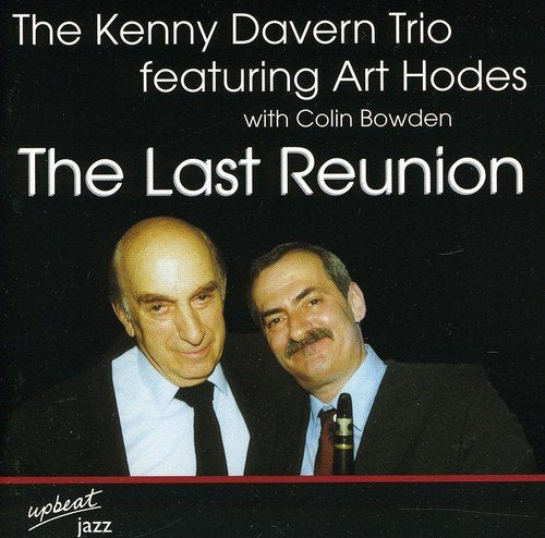 "CD cover with two men in suits, black background, and white text."