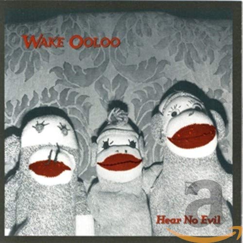 CD cover featuring three sock monkeys enacting the “hear no evil” principle.
