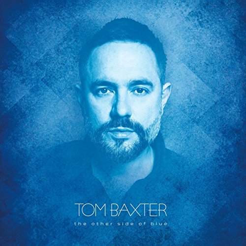 Album cover featuring a man with a beard, blue-toned, with artist and album name.