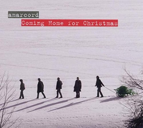 CD cover: snowy landscape with figures walking towards a Christmas tree.