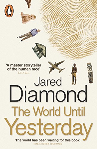"Book cover with a carved wooden mask and author's name, Jared Diamond, in black and orange text."