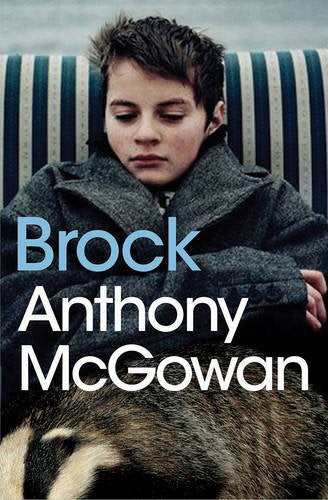 Book cover with a boy sitting on a striped sofa, eyes closed, with a dog below.