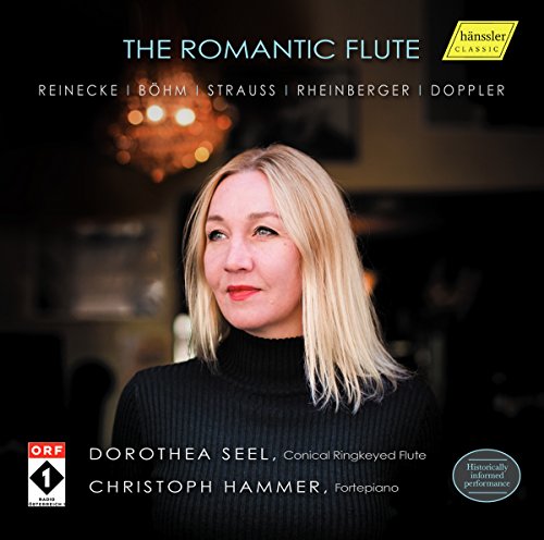 CD cover with a blonde woman in a black turtleneck against a dark background.