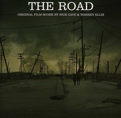 A darkened road with broken power lines and the title "The Road" at the top.