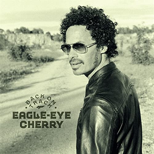 Eagle-Eye Cherry album cover: portrait of a man with curly hair and sunglasses.