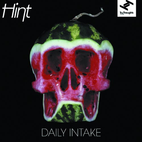 Watermelon carved into a skull on a black background with text "Hint" and "Daily Intake".