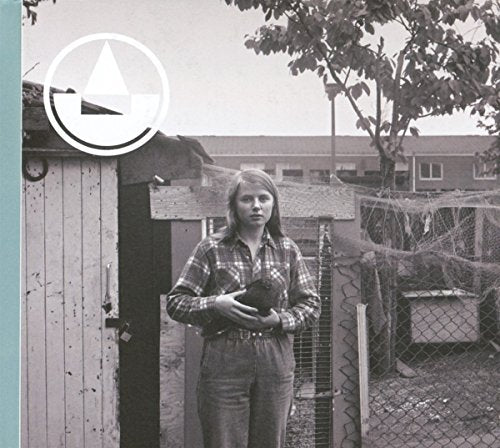 Black and white CD cover with a woman holding a pigeon.