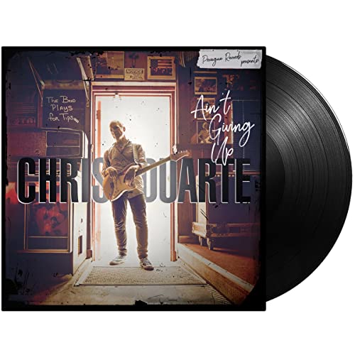 Chris Duarte album “Ain’t Giving Up” vinyl record with musician portrait.
