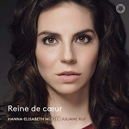 "CD cover featuring a woman with long, dark hair and brown eyes, against a dark background."