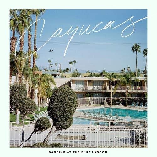 Album cover for Cayucas' "Dancing At The Blue Lagoon" with a poolside scene.