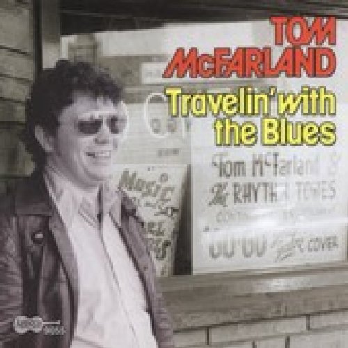 "CD cover with Tom McFarland in leather jacket, standing outside a music venue."