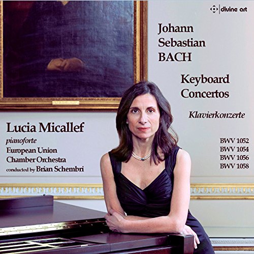 CD cover featuring a woman in black dress sitting at a piano.