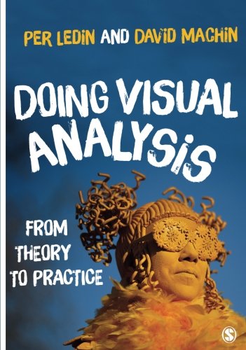 Book cover with a person wearing a mask and ornate headpiece on blue background.