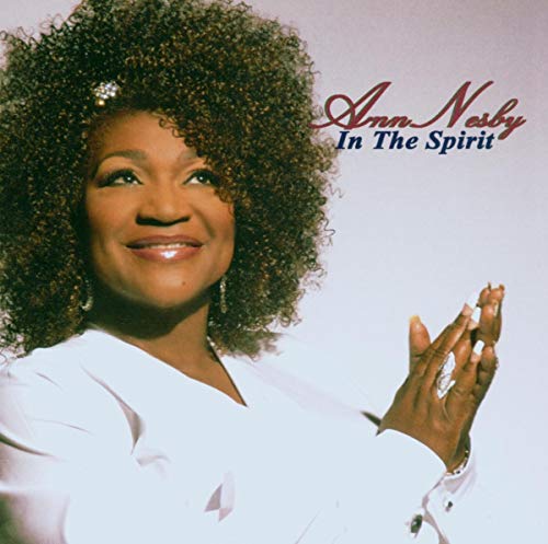 Ann Nesby album cover, portrait of a smiling Black woman with curly hair.