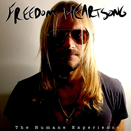 CD cover featuring a man with long blonde hair and sunglasses.