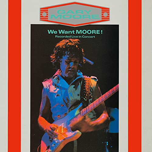 Gary Moore playing guitar on stage with orange and blue lighting effects.