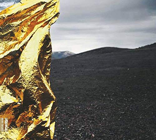 CD cover: golden rock formation against a dark, mountainous landscape.