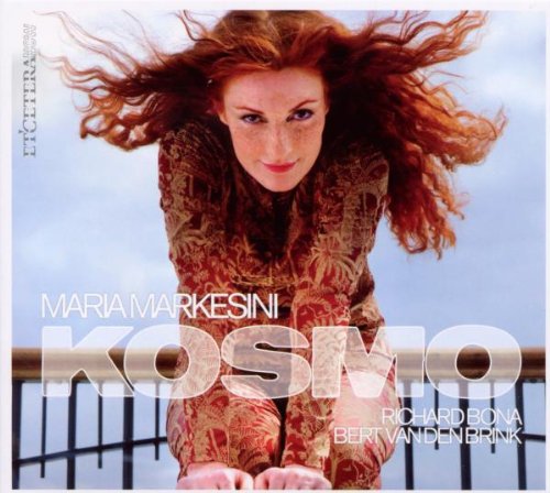 CD album cover featuring a woman with flowing red hair and patterned dress.