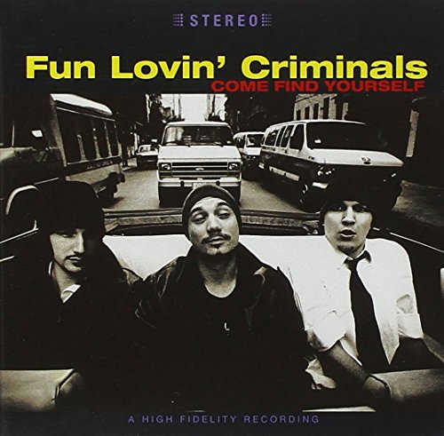 Album cover with three men in a car, black and white image, text overlay.