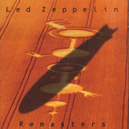 "Led Zeppelin Remasters album cover with shadowy figures on a wooden surface."