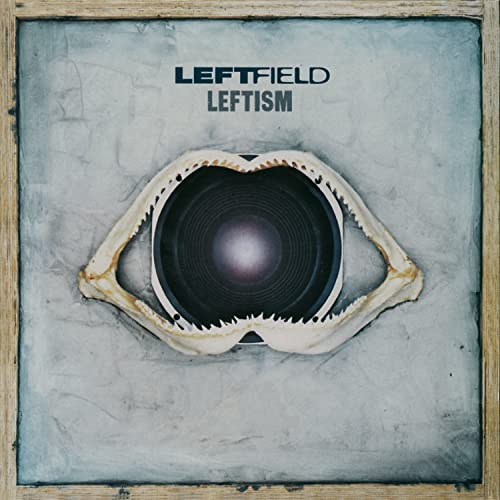 Album cover for Leftfield Leftism featuring a speaker cone framed by shark jaws.