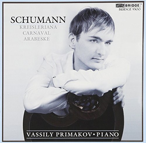 Black and white CD cover with a man resting on a piano.
