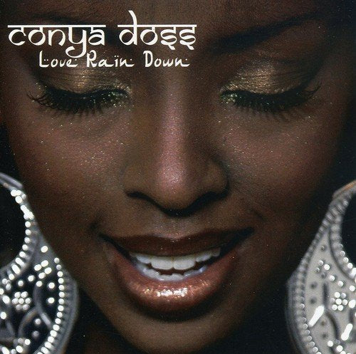 "CD cover featuring a close-up of a woman's face with large earrings."