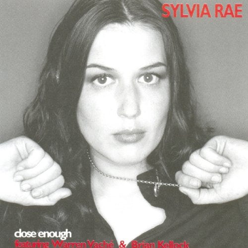Black and white album cover with a woman holding a chain around her neck.