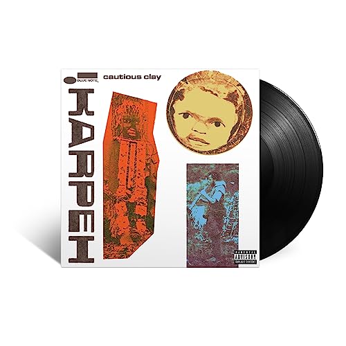 Vinyl record with album cover featuring portraits and abstract art.