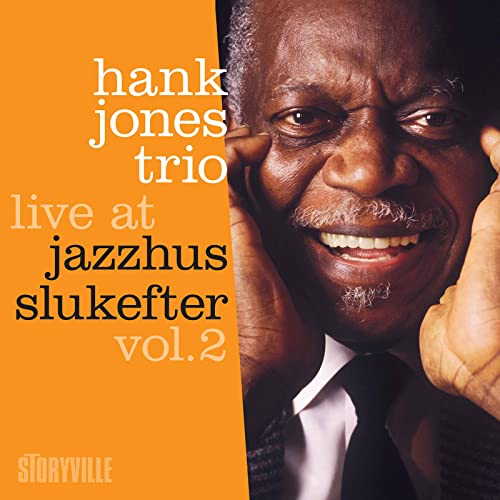 Close-up of smiling jazz pianist Hank Jones on album cover.